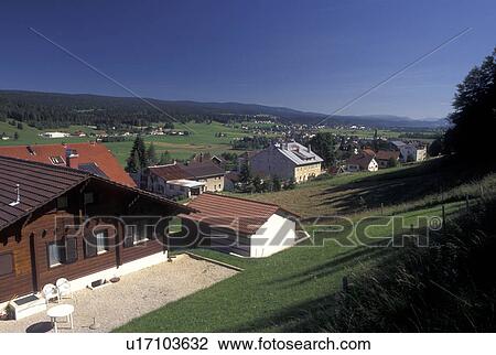 Stock Image -  Vallee de Joux, Switzerland, Vaud, Jura Mountains, Scenic view of Le Brassus in Vallee de Joux in the Jura mountain region.. Fotosearch