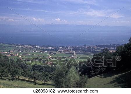 vineyard, La Cote, Switzerland, Vaud, Lake Geneva, Rolle, Scenic view of the countryside covered with vineyards and the village of Rolle along Lac Leman in the Canton of Vaud. Scenic view of the Alps across Lake Geneva. View Large Photo Image Stock Image - vineyard, La Cote, Switzerland, Vaud, Lake Geneva, Rolle, Scenic view of the countryside covered with vineyards and the village of Rolle along Lac Leman in the Canton of Vaud. Scenic view of the Alps across Lake Geneva.. Fotosearch
