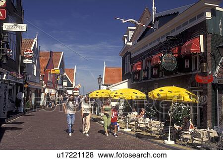 Volendam, Netherlands, Holland, Noord-Holland, Europe, Outdoor cafT and shops along a pedestrian street in the town of Volendam. View Large Photo Image Stock Photo - Volendam, Netherlands, Holland, Noord-Holland, Europe, Outdoor cafT and shops along a pedestrian street in the town of Volendam.. Fotosearch