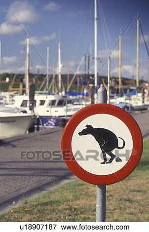 Stock Photo -  warning sign, Netherlands, Holland, Europe, Dog pooping restriction sign. Fotosearch