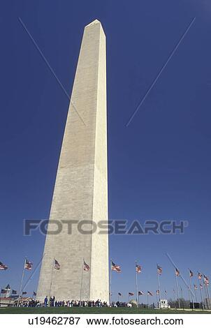 Washington Monument, Washington, DC, District of Columbia, Washington Monument surrounded by American Flags in the spring at National Mall in Washington, D. C. View Large Photo Image Stock Photo - Washington Monument, Washington, DC, District of Columbia, Washington Monument surrounded by American Flags in the spring at National Mall in Washington, D. C.. Fotosearch