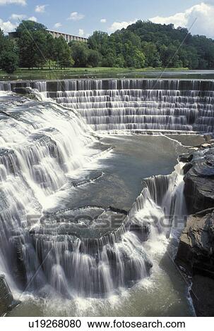 Stock Image -  waterfall, Ithaca, NY, New York, Finger Lakes, Triphammer Falls at Beebe Lake on the campus of Cornell University.. Fotosearch
