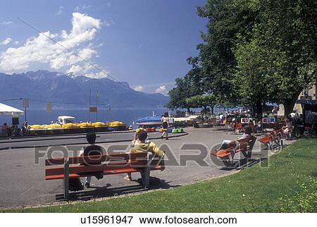 waterfront, Switzerland, Vevey, Lake Geneva, Vaud, Scenic view of the Alps from the lakefront park along Lac Leman in Vevey in the Canton of Vaud. View Large Photo Image Stock Photo - waterfront, Switzerland, Vevey, Lake Geneva, Vaud, Scenic view of the Alps from the lakefront park along Lac Leman in Vevey in the Canton of Vaud. . Fotosearch