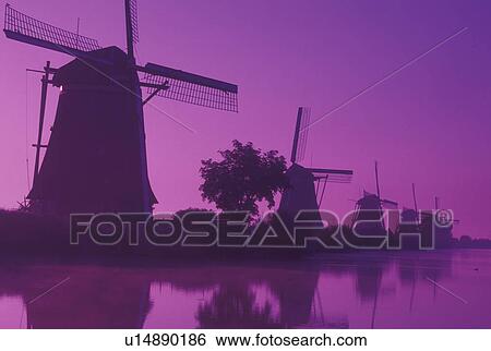 windmill, Kinderdijk, Netherlands, Holland, Zuid-Holland, Europe, Mills of Kinderdijk, Working windmills along a canal in the early morning mist in Kinderdijk. View Large Photo Image Stock Photograph - windmill, Kinderdijk, Netherlands, Holland, Zuid-Holland, Europe, Mills of Kinderdijk, Working windmills along a canal in the early morning mist in Kinderdijk. . Fotosearch