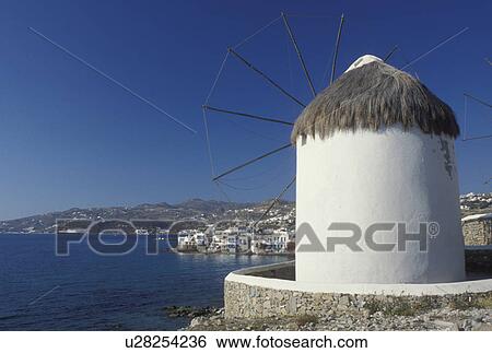 windmill, Mykonos, Greek Islands, Cyclades, Greece, Europe, Windmill on Mykonos and view of harbor on the Aegean Sea. View Large Photo Image Stock Photograph - windmill, Mykonos, Greek Islands, Cyclades, Greece, Europe, Windmill on Mykonos and view of harbor on the Aegean Sea.. Fotosearch