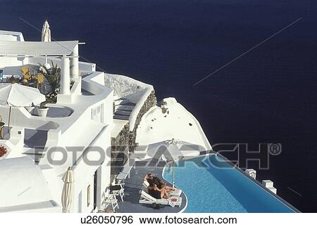 windmill, Santorini, Greece, Greek Islands, Oia, Cyclades, Europe, Resort with pool in the village of Oia overlooking the Aegean Sea on Santorini Island. View Large Photo Image Stock Photograph - windmill, Santorini, Greece, Greek Islands, Oia, Cyclades, Europe, Resort with pool in the village of Oia overlooking the Aegean Sea on Santorini Island.. Fotosearch