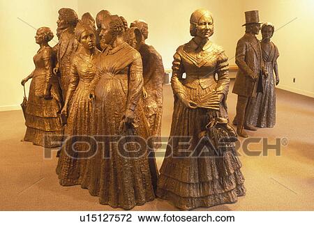 Stock Image -  Women's Rights, Seneca Falls, NY, New York, Finger Lakes, A statue of the women's movement is displayed at the Women's Rights National Historical Park Visitor Center in Seneca Falls. The birthplace of the women's rights movement.. Fotosearch