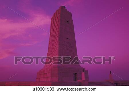 Wright Brothers National Memorial, NC, North Carolina, Outer Banks, The Wright Memorial Shaft on Kills Devil Hill in the Outer Banks of North Carolina at sunset. View Large Photo Image Stock Image - Wright Brothers National Memorial, NC, North Carolina, Outer Banks, The Wright Memorial Shaft on Kills Devil Hill in the Outer Banks of North Carolina at sunset.. Fotosearch