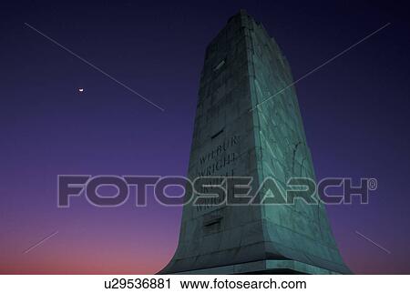 Wright Brothers National Memorial, NC, North Carolina, Outer Banks, Moonrise at The Wright Memorial Shaft on Kills Devil Hill in the Outer Banks of North Carolina. View Large Photo Image Stock Image - Wright Brothers National Memorial, NC, North Carolina, Outer Banks, Moonrise at The Wright Memorial Shaft on Kills Devil Hill in the Outer Banks of North Carolina.. Fotosearch