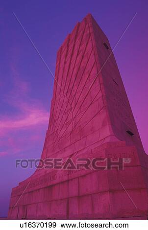 Stock Photo -  Wright Brothers National Memorial, Outer Banks, NC, North Carolina, The Wright Memorial Shaft on Kills Devil Hill in the Outer Banks of North Carolina at sunset.. Fotosearch