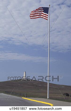 Wright Brothers National Memorial, North Carolina, Outer Banks, NC, U. S. Flag flies at the The Wright Memorial Shaft on Kills Devil Hill in the Outer Banks of North Carolina. View Large Photo Image Stock Photo - Wright Brothers National Memorial, North Carolina, Outer Banks, NC, U. S. Flag flies at the The Wright Memorial Shaft on Kills Devil Hill in the Outer Banks of North Carolina.. Fotosearch