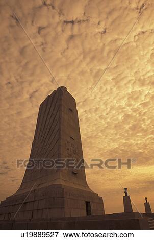 Wright Brothers National Memorial, North Carolina, Outer Banks, NC, The Wright Memorial Shaft on Kills Devil Hill in the Outer Banks of North Carolina at sunrise. View Large Photo Image Stock Photo - Wright Brothers National Memorial, North Carolina, Outer Banks, NC, The Wright Memorial Shaft on Kills Devil Hill in the Outer Banks of North Carolina at sunrise.. Fotosearch