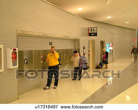 Stock Photo -  airport, Philadelphia, PA, Pennsylvania, Telephones at the Philadelphia International Airport in Philadelphia.. Fotosearch
