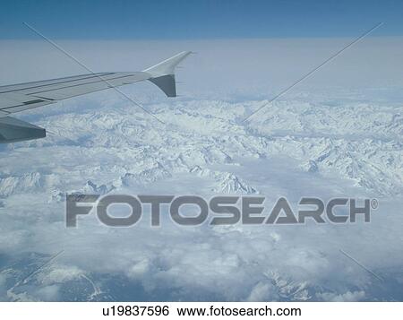 Alps, Europe, Aerial view of the Alps from an airplane View Large Photo Image Stock Photograph - Alps, Europe, Aerial view of the Alps from an airplane . Fotosearch
