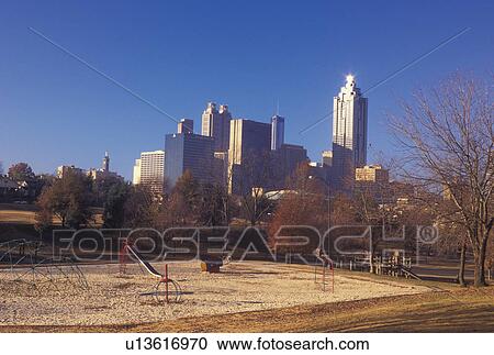 Stock Image -  Atlanta, GA, Georgia, Downtown skyline from Bedford Pine Park, fall. Fotosearch
