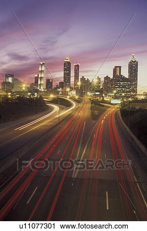 Atlanta, GA, Georgia, Downtown skyline, Presidential Parkway, evening, expressway, streaks of red and white car lights View Large Photo Image Stock Image - Atlanta, GA, Georgia, Downtown skyline, Presidential Parkway, evening, expressway, streaks of red and white car lights. Fotosearch