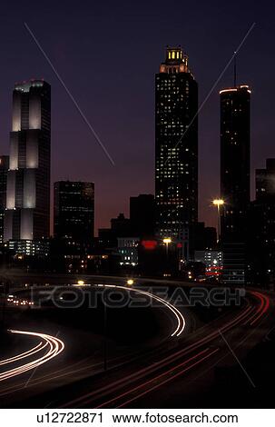 Atlanta, GA, Georgia, Downtown skyline, Freedom Parkway, evening, traffic, streaks of car lights along the expressway, road View Large Photo Image Stock Image - Atlanta, GA, Georgia, Downtown skyline, Freedom Parkway, evening, traffic, streaks of car lights along the expressway, road. Fotosearch