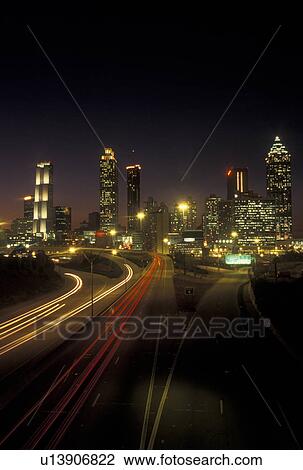 Atlanta, GA, Georgia, Downtown skyline, Freedom Parkway, evening, traffic, streaks of car lights along the expressway, road View Large Photo Image Stock Image - Atlanta, GA, Georgia, Downtown skyline, Freedom Parkway, evening, traffic, streaks of car lights along the expressway, road. Fotosearch