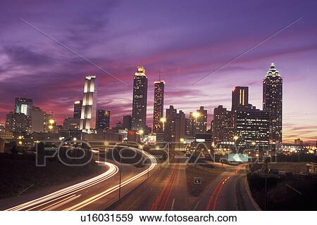 Atlanta, GA, Georgia, Downtown skyline, Presidential Parkway, evening, expressway, streaks of red and white car lights View Large Photo Image Stock Photo - Atlanta, GA, Georgia, Downtown skyline, Presidential Parkway, evening, expressway, streaks of red and white car lights. Fotosearch