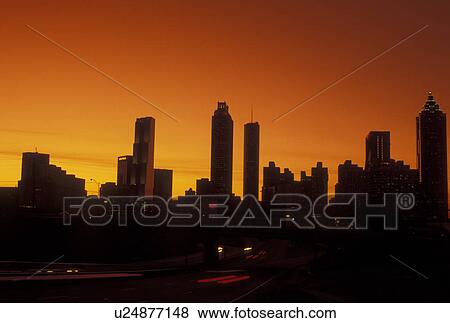 Atlanta, GA, Georgia, Downtown skyline, Freedom Parkway, evening, traffic, streaks of car lights along the expressway, road View Large Photo Image Stock Photo - Atlanta, GA, Georgia, Downtown skyline, Freedom Parkway, evening, traffic, streaks of car lights along the expressway, road. Fotosearch
