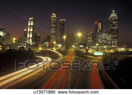 Atlanta, GA, Georgia, Downtown skyline, Freedom Parkway, evening, traffic, streaks of car lights along the expressway, road View Large Photo Image Stock Photography - Atlanta, GA, Georgia, Downtown skyline, Freedom Parkway, evening, traffic, streaks of car lights along the expressway, road. Fotosearch