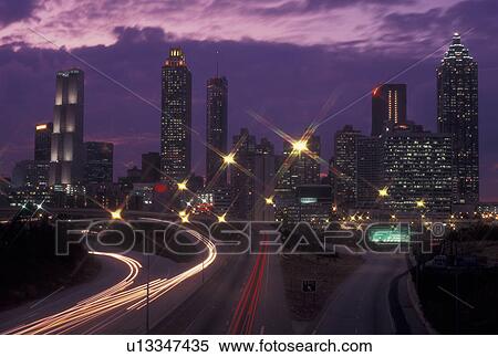 Atlanta, GA, Georgia, Downtown skyline, Freedom Parkway, evening, streaks of car lights along the expressway, road, transportation, traffic View Large Photo Image Stock Photography - Atlanta, GA, Georgia, Downtown skyline, Freedom Parkway, evening, streaks of car lights along the expressway, road, transportation, traffic. Fotosearch