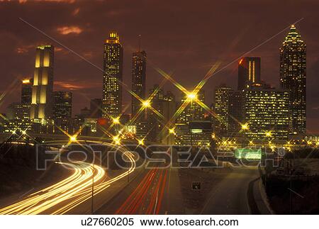 Atlanta, GA, Georgia, Downtown skyline, Freedom Parkway, evening, streaks of car lights along the expressway, road, transportation, traffic View Large Photo Image Stock Photography - Atlanta, GA, Georgia, Downtown skyline, Freedom Parkway, evening, streaks of car lights along the expressway, road, transportation, traffic. Fotosearch