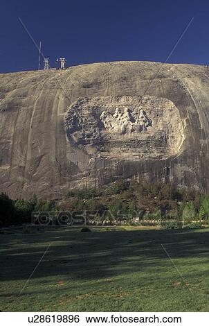 Stock Photograph -  Atlanta, GA, Georgia, Georgia Stone Mountain Park, Confederate Memorial Carving on Stone Mountain, President Jefferson Davis, General Thomas Stonewall Jackson and General Robert E. Lee, granite rock. Fotosearch