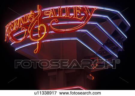 Stock Photo -  Atlanta, GA, Georgia, Kenny's Alley at Underground Atlanta, neon lights, evening. Fotosearch