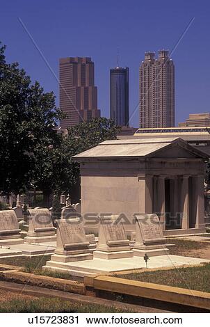 Stock Image -  Atlanta, GA, Georgia, Oakland Cemetery, Atlanta Skyline. Fotosearch