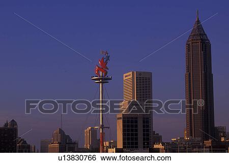 Stock Photograph -  Atlanta, GA, Georgia, Olympic Logo at Coca-Cola Olympic City, downtown skyline. Fotosearch