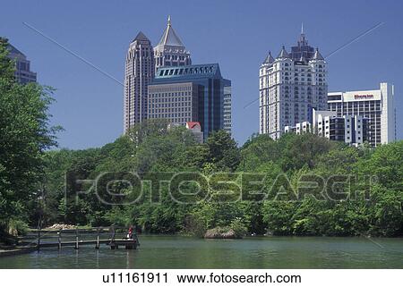 Stock Image -  Atlanta, GA, Georgia, Piedmont Park, Midtown skyline. Fotosearch