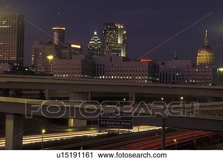 Atlanta, GA, Georgia, skyline, downtown, streak of car lights along I-85/75 & I-20, evening, expressway, interstate View Large Photo Image Stock Image - Atlanta, GA, Georgia, skyline, downtown, streak of car lights along I-85/75 & I-20, evening, expressway, interstate. Fotosearch