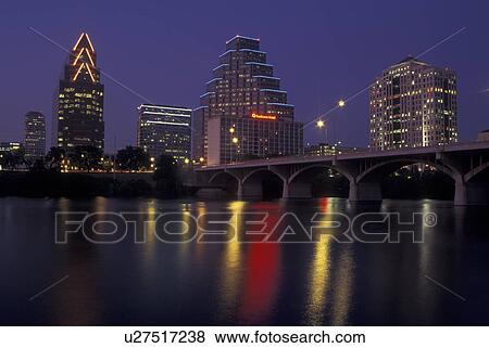 Stock Photo -  Austin, TX, Texas, Colorado River, downtown skyline, evening. Fotosearch