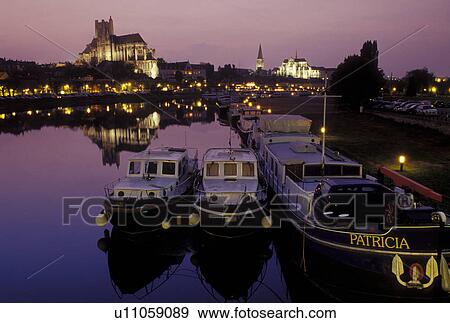 Auxerre, France, Burgundy, Yonne, Bourgogne, Europe, wine region, View of the Cathedral St. Etienne and house barges along the Yonne River in the evening in the city of Auxerre. View Large Photo Image Stock Photo - Auxerre, France, Burgundy, Yonne, Bourgogne, Europe, wine region, View of the Cathedral St. Etienne and house barges along the Yonne River in the evening in the city of Auxerre.. Fotosearch