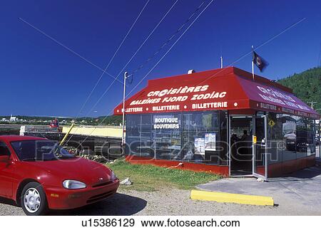 Stock Photo -  Baie-Sainte-Catherine, Quebec, Canada, Whale-watching Excursions and souvenir Kiosk in the town of Baie-Ste-Catherine along the St. Lawrence River.. Fotosearch