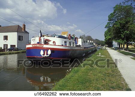 barge, Burgundy, France, St. Leger-s-Dheune, Saone-et-Loire, Bourgogne, Europe, wine region, House barges docked along Canal du Centre in the town of St. Leger-s-Dheune. View Large Photo Image Stock Image - barge, Burgundy, France, St. Leger-s-Dheune, Saone-et-Loire, Bourgogne, Europe, wine region, House barges docked along Canal du Centre in the town of St. Leger-s-Dheune.. Fotosearch