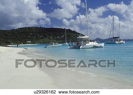 Stock Image -  beach, Jost Van Dyke, British Virgin Islands, Caribbean, BVI, View of beach and boats anchored in White Bay on Jost Van Dyke Island on the Caribbean Sea.. Fotosearch