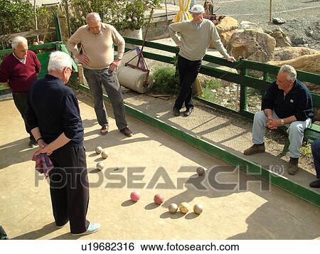 bocce, Liguria, Italy, Sestri Levante, Riviera di Levante, Ligurian Riviera, Europe, Senior Italian men playing the game of Bocce on the waterfront in Sestri Levante along the Ligurian Sea. View Large Photo Image Stock Photograph - bocce, Liguria, Italy, Sestri Levante, Riviera di Levante, Ligurian Riviera, Europe, Senior Italian men playing the game of Bocce on the waterfront in Sestri Levante along the Ligurian Sea.. Fotosearch