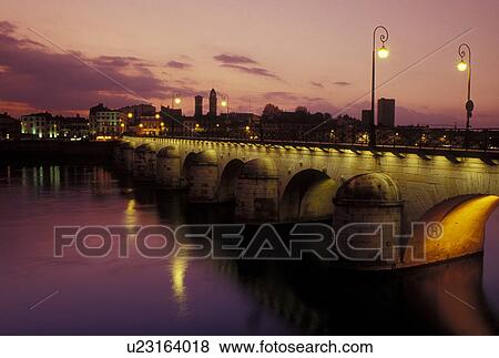 bridge, Burgundy, Macon, Saone-et-Loire, France, Bourgogne, Europe, wine region, The 11th century Pont de St-Laurent spans the Saone River in the city of Macon in the evening. View Large Photo Image Stock Photo - bridge, Burgundy, Macon, Saone-et-Loire, France, Bourgogne, Europe, wine region, The 11th century Pont de St-Laurent spans the Saone River in the city of Macon in the evening.. Fotosearch