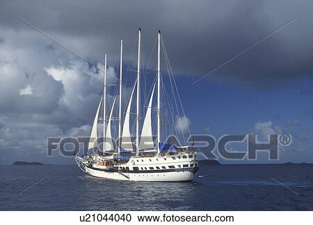 British Virgin Islands, Caribbean, BVI, Sailing vessel on the Caribbean Sea. View Large Photo Image Stock Image - British Virgin Islands, Caribbean, BVI, Sailing vessel on the Caribbean Sea.. Fotosearch
