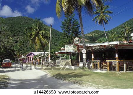 Stock Photo -  British Virgin Islands, Jost Van Dyke, Caribbean, BVI, Shops and restaurants on Main Street on Jost Van Dyke Island.. Fotosearch