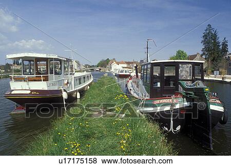 Burgundy, France, St. Leger-s-Dheune, Saone-et-Loire, Bourgogne, Europe, wine region, House barges docked along Canal du Centre in the town of St. Leger-s-Dheune. View Large Photo Image Stock Photo - Burgundy, France, St. Leger-s-Dheune, Saone-et-Loire, Bourgogne, Europe, wine region, House barges docked along Canal du Centre in the town of St. Leger-s-Dheune.. Fotosearch