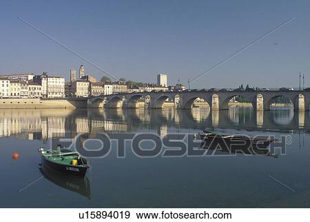 Burgundy, Macon, France, Saone-et-Loire, Bourgogne, Europe, wine region, The 11th century Pont de St-Laurent spans the Saone River in the city of Macon. View Large Photo Image Stock Photo - Burgundy, Macon, France, Saone-et-Loire, Bourgogne, Europe, wine region, The 11th century Pont de St-Laurent spans the Saone River in the city of Macon.. Fotosearch