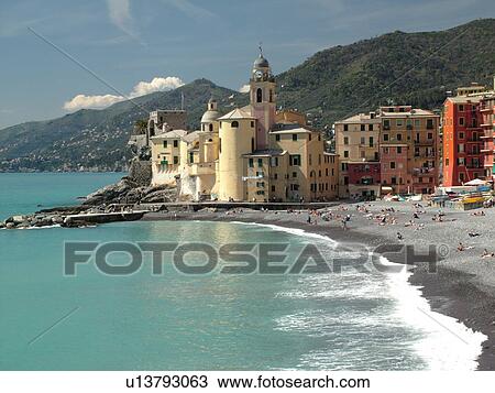 Stock Image -  Camogli, Italy, Liguria, Riviera di Levante, Ligurian Riviera, Europe, The beach along the waterfront of the resort town of Camogli along the Ligurian Sea.. Fotosearch