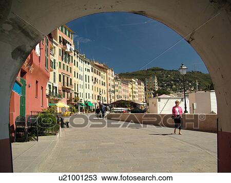 Camogli, Italy, Liguria, Riviera di Levante, Ligurian Riviera, Europe, Looking through an archway at the pastel-coloured buildings along the waterfront of the resort town of Camogli along the Ligurian Sea. View Large Photo Image Stock Image - Camogli, Italy, Liguria, Riviera di Levante, Ligurian Riviera, Europe, Looking through an archway at the pastel-coloured buildings along the waterfront of the resort town of Camogli along the Ligurian Sea.. Fotosearch