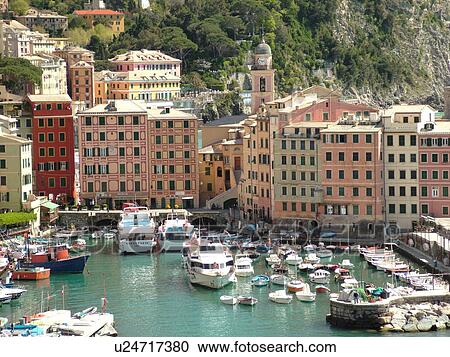 Stock Image -  Camogli, Liguria, Italy, Riviera di Levante, Ligurian Riviera, Europe, Scenic view of the fishing harbor in the resort town of Camogli along the Ligurian Sea.. Fotosearch