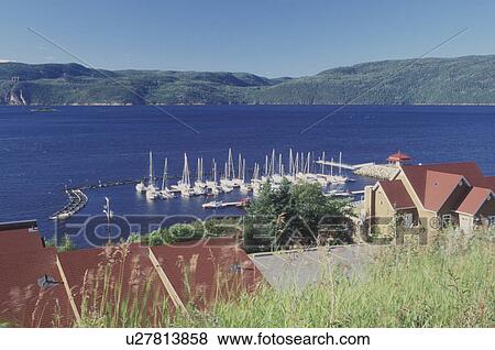 Canada, L'Anse St. Jean, Quebec, Overlooking a marina along the Saguenay Fjord and River in L'Anse St. Jean. View Large Photo Image Stock Photo - Canada, L'Anse St. Jean, Quebec, Overlooking a marina along the Saguenay Fjord and River in L'Anse St. Jean.. Fotosearch