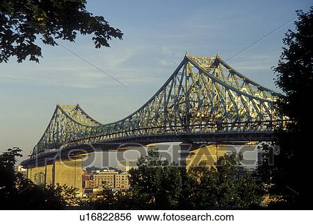 Stock Photograph -  Canada, Montreal, Quebec, Pont Jacques Cartier (Jacques Cartier Bridge) crosses the St. Lawrence River (Fleuve Saint-Laurent) in Montreal.. Fotosearch