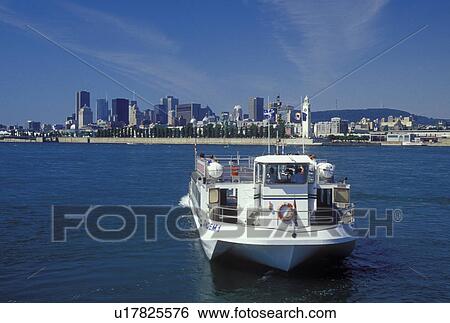 Canada, Montreal, Quebec, Sightseeing tourboat cruises along the St. Lawrence River (Fleuve Saint-Laurent) with a view of the Montreal skyline. View Large Photo Image Stock Photograph - Canada, Montreal, Quebec, Sightseeing tourboat cruises along the St. Lawrence River (Fleuve Saint-Laurent) with a view of the Montreal skyline.. Fotosearch